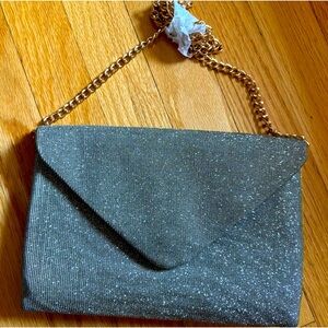 Brand new gold envelope style clutch.